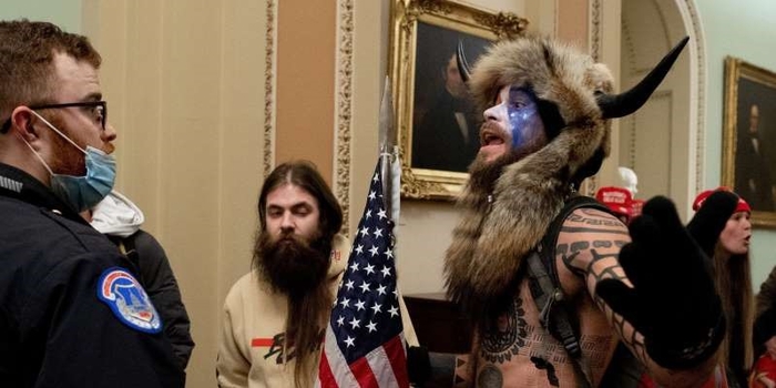 Lawyer for the 'Q Shaman' who stormed the Capitol in a fur headdress with horns says his client feels 'duped'