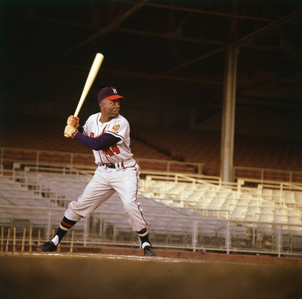 Baseball legend Hank Aaron sitting at a gas station in Mobile